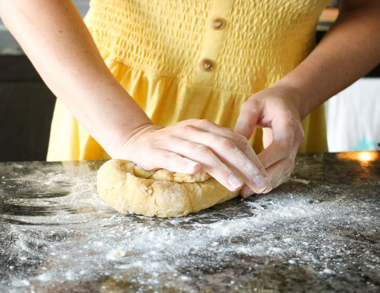 homemade pasta dough being kneaded
